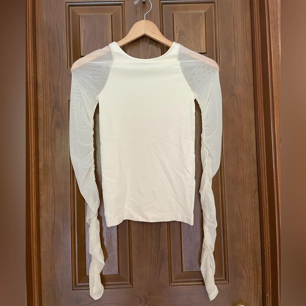 Free People intimately long sleeved top with sheer mesh sleeves